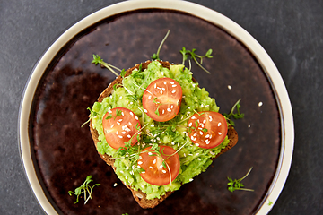 Image showing toast bread with mashed avocado and cherry tomato