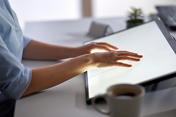 Image showing hands on led light tablet at night office