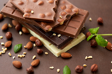 Image showing close up of different chocolate bars and nuts