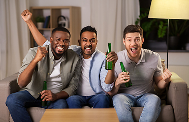 Image showing happy male friends or fans drinking beer at home