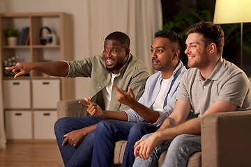 Image showing male friends watching tv and talking at home