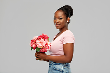 Image showing happy african american woman with bunch of flowers