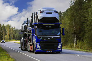 Image showing Blue Volvo FM Car Transporter Hauls New Cars