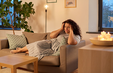 Image showing woman suffering from headache at home