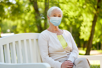Image showing senior woman in protective medical mask at park