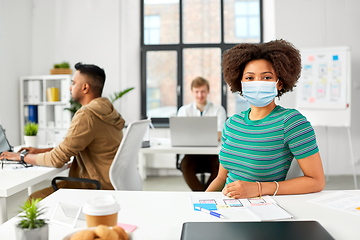 Image showing african american woman in medical mask at office