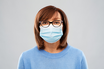 Image showing senior woman in protective medical mask