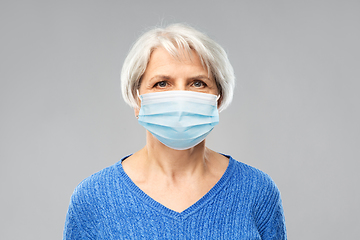 Image showing senior woman in protective medical mask