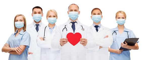 Image showing doctors in protective medical masks with red heart