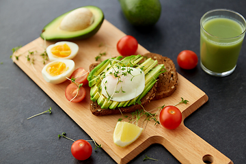 Image showing toast bread with avocado, eggs and cherry tomatoes