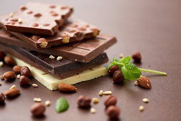 Image showing close up of different chocolate bars and nuts