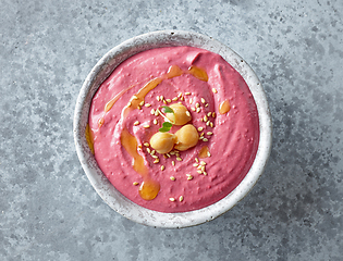 Image showing bowl of hummus with beet