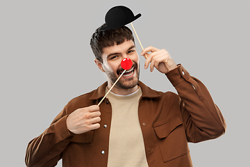 Image showing smiling man with bowler hat and red clown nose