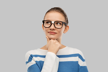 Image showing thinking teenage student girl in taped glasses