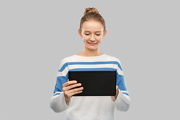 Image showing happy smiling teenage girl using tablet computer