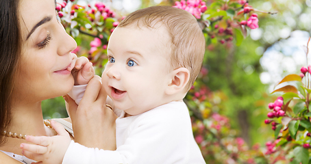 Image showing mother with baby over spring garden background