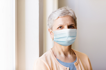 Image showing senior woman in protective medical mask