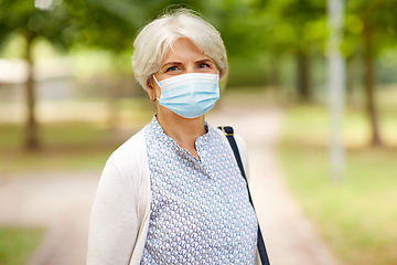 Image showing senior woman in protective medical mask in park