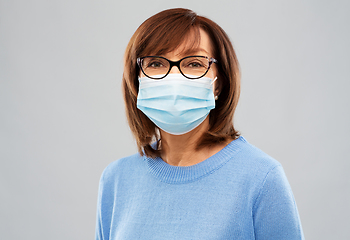 Image showing senior woman in protective medical mask