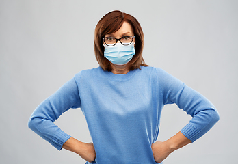 Image showing senior woman in protective medical mask
