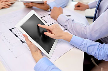 Image showing architects with tablet pc and blueprint at office