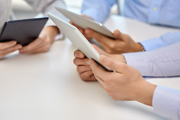 Image showing close up of business team with tablet pc at office