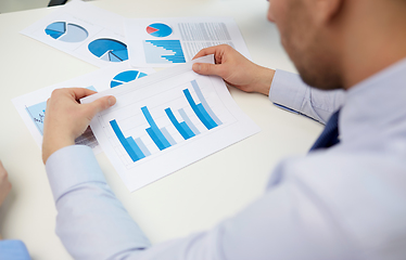 Image showing close up of businessman's hands with charts