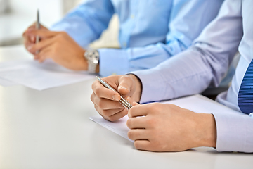 Image showing hands of business people at conference at office