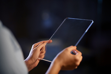 Image showing hands with transparent tablet pc computer