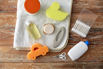 Image showing baby accessories for bathing on wooden table