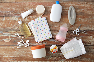 Image showing baby accessories for bathing on wooden table