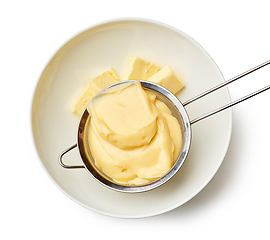 Image showing custard cream in a strainer