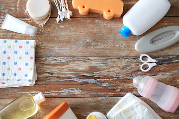 Image showing baby accessories for bathing on wooden table