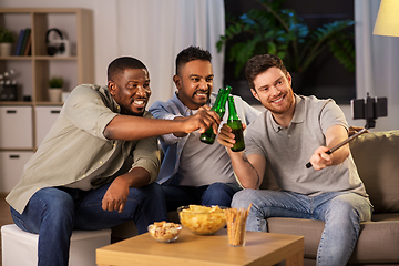 Image showing male friends with smartphone taking selfie at home