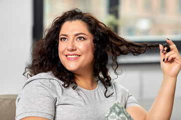 Image showing portrait of happy young woman at home