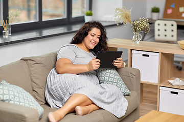 Image showing woman with tablet pc computer on sofa at home