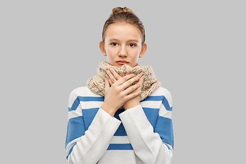 Image showing sick teenage girl in scarf over grey background