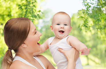 Image showing mother with baby over green natural background