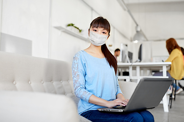 Image showing asian woman with laptop in medical mask at office