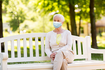 Image showing senior woman in protective medical mask at park