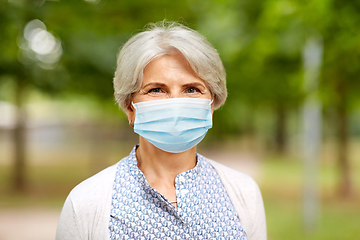 Image showing senior woman in protective medical mask in park