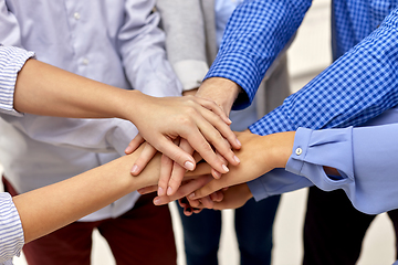 Image showing close up of people stacking hands