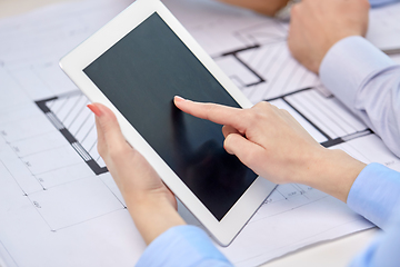 Image showing architects with tablet pc and blueprint at office