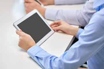 Image showing close up of businesswoman with tablet pc at office