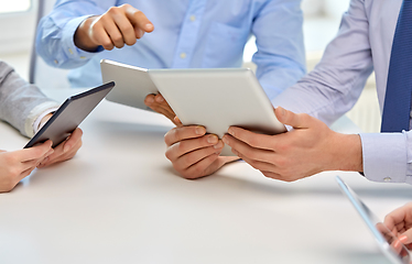 Image showing close up of business team with tablet pc at office