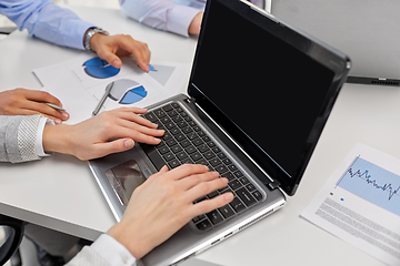 Image showing close up of businesspeople with laptop at office