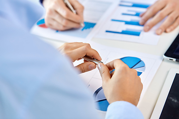 Image showing close up of businessman's hands with charts