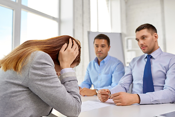 Image showing desperate woman on job interview at office