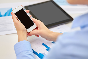 Image showing close up of woman with smartphone at office