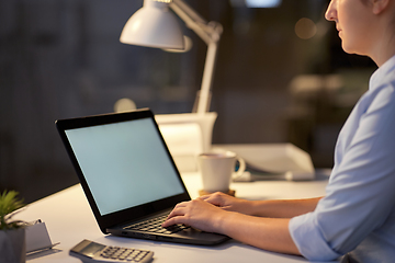 Image showing businesswoman with laptop at dark night office